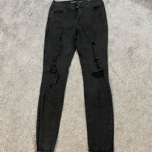 Distressed black skinny jeans